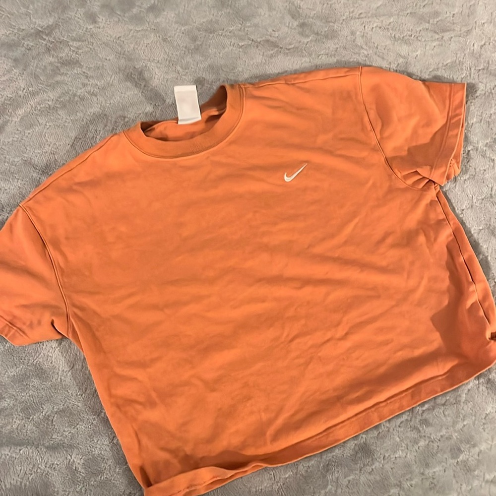 orange salmon nike top